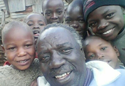 BISHOP SAMSON WALALA WITH SOME OF THE ORPHANAGE'S CHILDREN